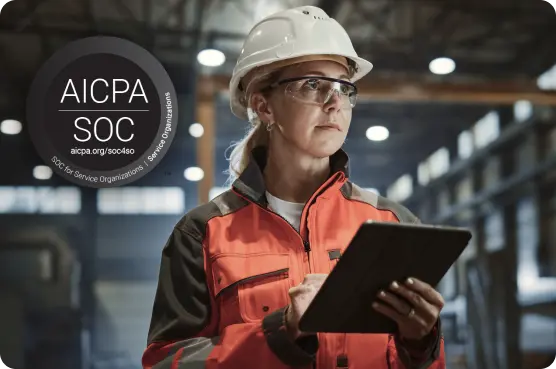 Connected hydration 6 Engineer in safety gear using tablet with AICPA SOC certification badge