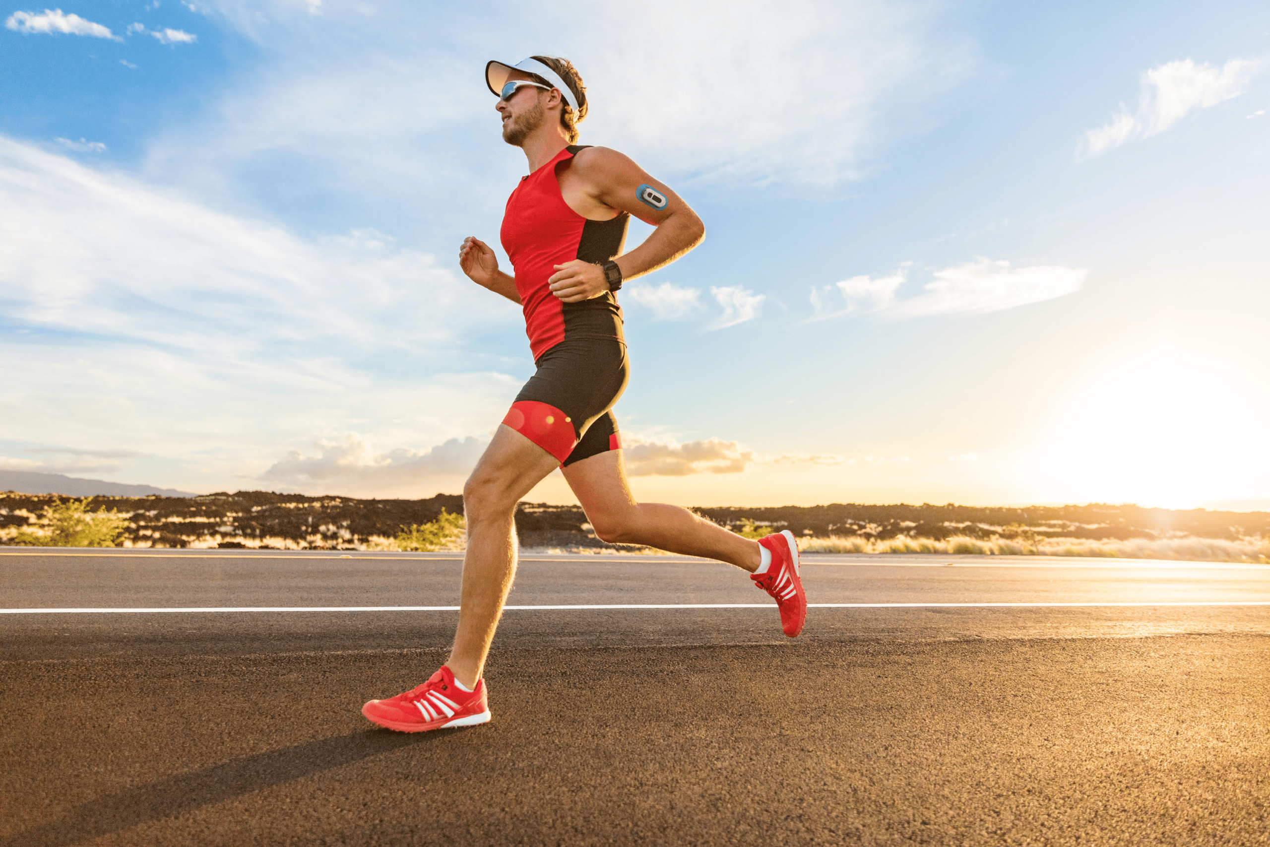 Research 15 Athlete running with wearable hydration sensor on arm