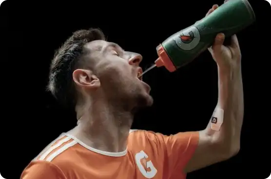 GX Sweat Patch 6 Athlete drinking water with Gx patch on arm